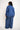 Person wearing a blue outfit with a striped pattern on a white background