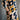 Person wearing a patterned dress with geometric design against a gray background