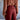 Person wearing a brown blouse and red pants against a blurred background
